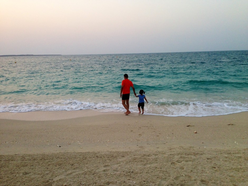 Weekly Photo Challenge: Scale My little family looks miniscule by the infinite sea.