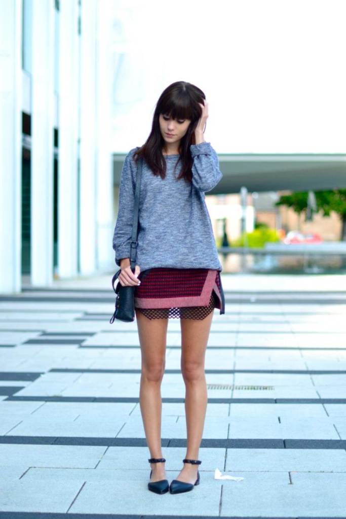 Even with flats, the model's higher hemline makes her appear taller.